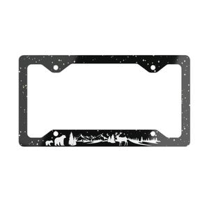 May include: Black license plate frame with a starry night sky design. The bottom features a white silhouette of a bear, trees, mountains, and a deer. The frame has four screw holes.