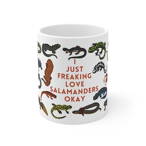 May include: White ceramic mug with a colorful illustration of various salamanders and the text "I just freaking love salamanders okay".