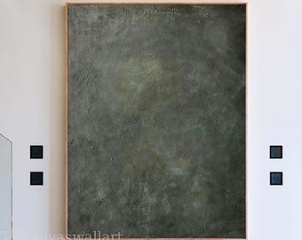 May include: A large rectangular wall art piece featuring a dark, textured surface in shades of deep olive green and charcoal gray. The artwork has a matte, weathered appearance with subtle variations in tone and a visible, rough impasto texture.