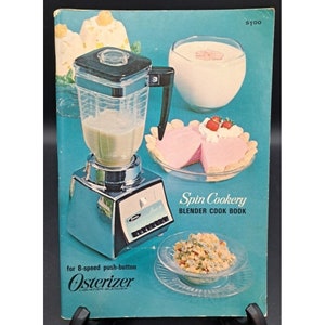 May include: A vintage cookbook titled "Spin Cookery: Blender Cook Book" for 8-speed push-button Osterizer liquefier-blender. The cover features a silver blender, a pink dessert, and a bowl of food.