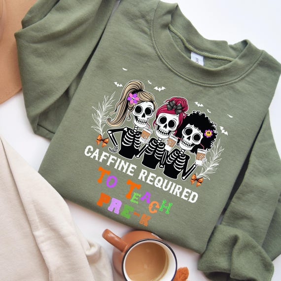 Unisex Sweatshirt | Gildan 18000 | Pre-K Teacher Halloween Shirt – Skeleton Drinking Coffee with Coquette Bow