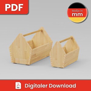 Może przedstawiać: Dwa jasne drewniane koszyki z otwartą górą i poziomymi uchwytami. Każdy koszyk ma pięciokątny profil boczny z widocznymi połączeniami na wczepy na rogach. Obraz zawiera ikonę PDF oraz okrągłą odznakę z napisem Maße in mm.