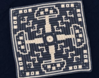May include: A square crocheted piece with a geometric pattern in white and dark blue. The pattern is symmetrical and features a central circle.