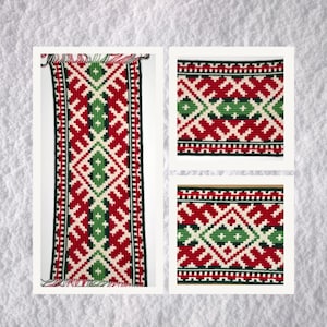May include: A red, green, and white crocheted runner with a geometric pattern. The runner is made of yarn and has a fringe on the ends.