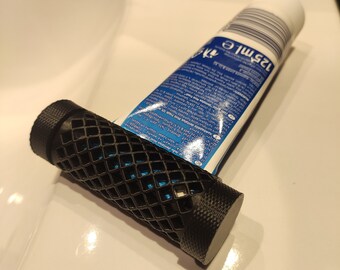 Toothpaste extractor squeezer topper holder dispenser