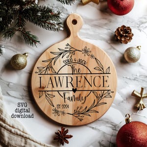 May include: A round wooden cutting board with a floral design and the text "Sara & Jack The Lawrence Family Est. 2024".
