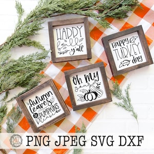 May include: Four square wooden signs with dark brown frames and white centres featuring black text and graphics. The signs display the phrases Happy fall y'all, Happy TURKEY day, Autumn leaves & PUMPKINS please, and oh my gourd with pumpkin illustrations.