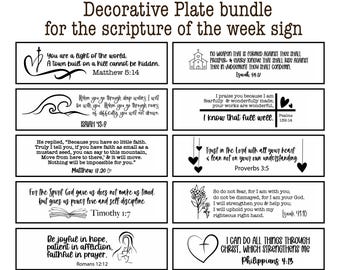 May include: A decorative plate bundle for the scripture of the week sign featuring ten rectangular labels with black text and illustrations of religious verses including Matthew 5:14, Isaiah 54:17, Isaiah 43:2, Psalms 139:14, Matthew 17:20, Proverbs 3:5, Timothy 1:7, Isaiah 41:10, Romans 12:12, and Philippians 4:13.