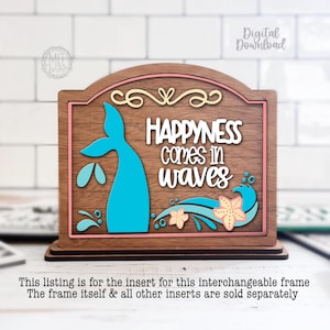 May include: Wooden sign with the text "HAPPINESS comes in waves" and a blue mermaid tail design. The sign has a brown background with pink and yellow accents. The sign is a digital download.