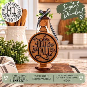 May include: A circular wooden sign insert featuring the black text HELLO FALL with leaf illustrations. The sign is suspended by a black and white gingham ribbon bow from a wooden stand. The text THIS LISTING IS FOR THE INSERT is visible.