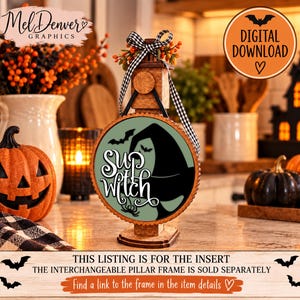 May include: A round wooden sign insert featuring a sage green background, a black witch hat silhouette, and the white text "sup witch" with a small spider graphic. The insert is topped with a black and white gingham ribbon bow.