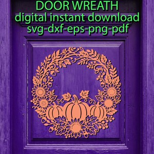 May include: A digital graphic of a pumpkin and sunflower wreath in light orange on a purple door background. The text reads: DOOR WREATH, digital instant download, svg-dxf-eps-png-pdf. The design features intricate leaves, acorns, and pumpkins.
