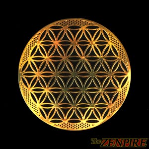 May include: A gold-colored, circular decorative piece featuring a geometric flower of life pattern. The design is composed of overlapping circles and symmetrical shapes. The edge has a dotted border. The Zenpire logo is in the bottom right corner.