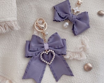 Beautiful gentle purple bow pearl keychain charm heart-shaped key chain ring bag charm Custom Keychain AirPods Case Keyring Charm Accessory