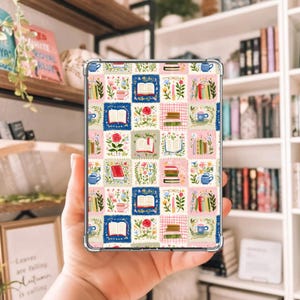 May include: A clear tablet case featuring a colorful patchwork design with books, flowers, and teacups. The design includes squares with open books, stacks of books, and floral arrangements in pink, blue, and green.