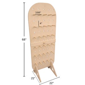 May include: A light-colored wooden pegboard display stand with a rounded top, featuring multiple rows of protruding pegs. The stand measures 68 inches in height, 22 inches in width, and 21 inches in depth, with individual pegs measuring 3.66 inches long and 4 inches apart.