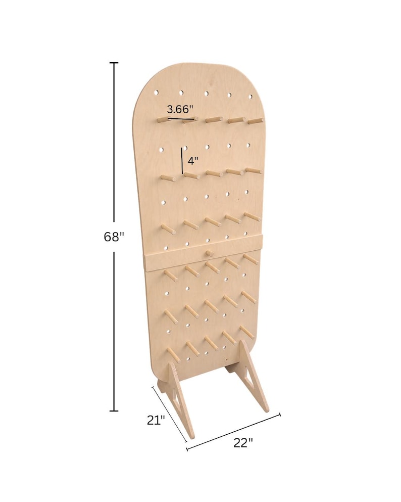 May include: A light-colored wooden pegboard display stand with a rounded top, featuring multiple rows of protruding pegs. The stand measures 68 inches in height, 22 inches in width, and 21 inches in depth, with individual pegs measuring 3.66 inches long and 4 inches apart.