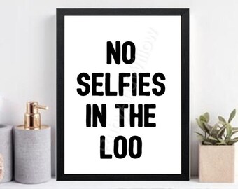 May include: Black and white framed print with the text "No Selfies in the Loo" on a white background.