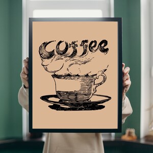 May include: A black and white illustration of a coffee cup with steam rising above it. The steam is shaped like the word "Coffee".