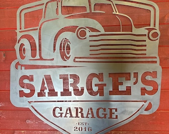 May include: Metal sign with a vintage truck silhouette, the words "Sarge's Garage" and the text "Est. 2016".