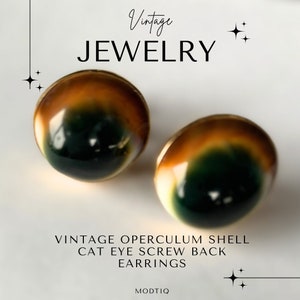 May include: Vintage cat's eye earrings made from operculum shell with a screw back fastening. The earrings are brown, green, and gold.