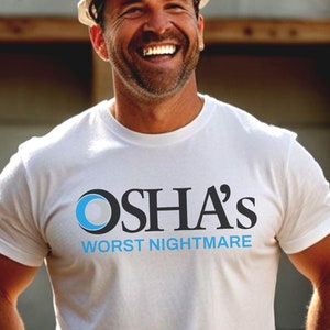 May include: A man wearing a white hard hat and a white t-shirt with a blue circle and the text "OSHA's WORST NIGHTMARE".