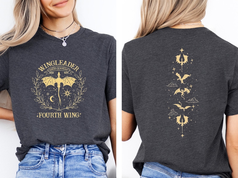 May include: A dark gray t-shirt with a gold graphic of a dragon with the text "WINGLEADER RIDERS GUARDIAN FOURTH WING" on the front. The back of the shirt has a vertical row of gold dragon graphics.