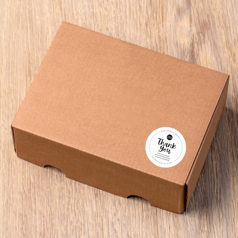 May include: A brown cardboard box with a white round sticker that says "Thank you" and "For your order, we hope you enjoy your new game!"  The sticker also includes the text "Your Board Game" and a website address.
