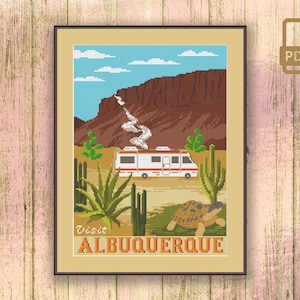 May include: A cross-stitch pattern featuring a vintage travel poster design with a white camper van, a desert landscape, and the text "Visit Albuquerque".