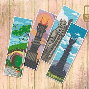 Op de afbeelding: Vier kleurrijke bladwijzerontwerpen met iconische locaties uit The Lord of the Rings en The Hobbit. De bladwijzers tonen de Shire, Barad-dûr, de Witte Stad Minas Tirith en de toren van Cirith Ungol.