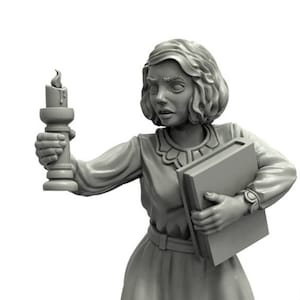May include: A gray painted miniature figurine of a woman holding a book and a candle. The figurine is standing on a gray painted base with a wood grain texture.