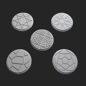 May include: Five round, white, decorative tiles with different geometric patterns. The tiles are made of a textured material and have a slightly raised design.
