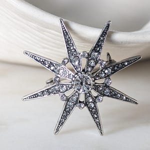 Large Silver Tone Metal and Diamanté Star Burst Brooch