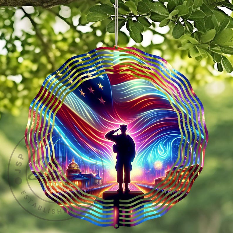 May include: A metal wind spinner with a silhouette of a soldier saluting in front of an American flag with a cityscape in the background. The flag is red, white, and blue with a glowing effect. The soldier is black and the cityscape is gold.
