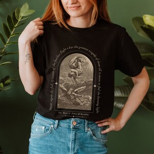 May include: Black t-shirt with a vintage illustration of Icarus falling from the sky. The text reads "Never regret thy fall, O Icarus of the fearless flight. For the greatest tragedy of them all is never to feel the burning light." The Myth of Icarus & Daedalus.
