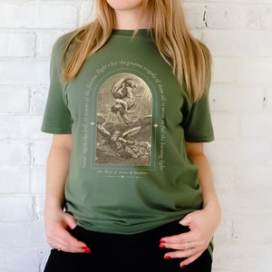 May include: Green t-shirt with a vintage illustration of Icarus falling from the sky. The text reads "Never regret thy fall, O Icarus of the fearless flight. For the greatest tragedy of them all is never to feel the burning light. The Myth of Icarus & Daedalus."