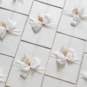 Wedding invitations with white bow