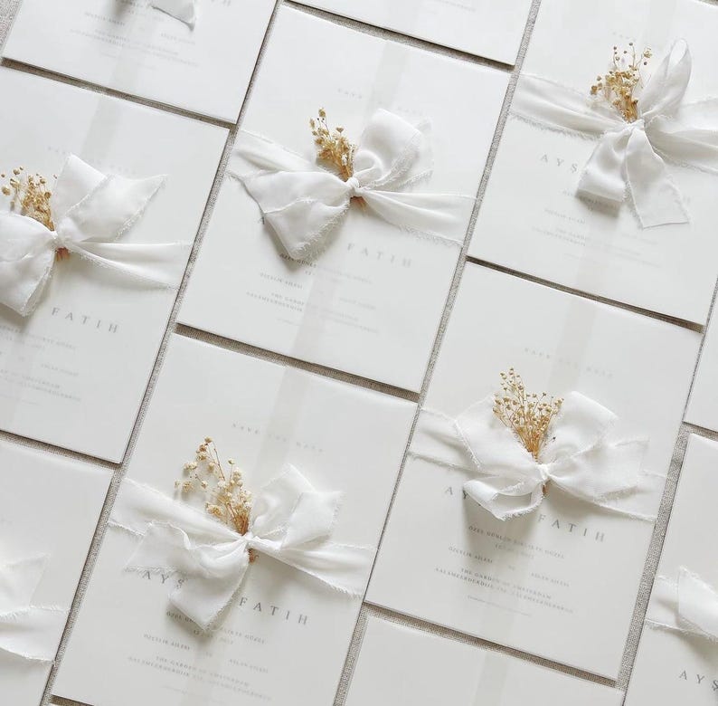 Wedding invitations with white bow