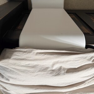 showing intended use of bFan with adapter under comforter