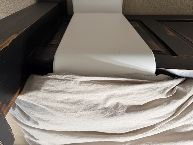 showing intended use of bFan with adapter under comforter