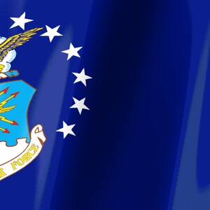 May include: The United States Air Force flag features a deep blue field with a central emblem. The emblem includes a golden eagle, a shield with yellow lightning bolts, and a white scroll with the text AIR FORCE in bold yellow capital letters.