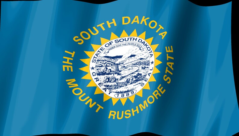 May include: The blue flag of South Dakota features a central yellow sunburst surrounding the state seal. The seal depicts a landscape with a river, hills, and a mine. Text reads THE MOUNT RUSHMORE STATE, SOUTH DAKOTA, and STATE OF SOUTH DAKOTA.