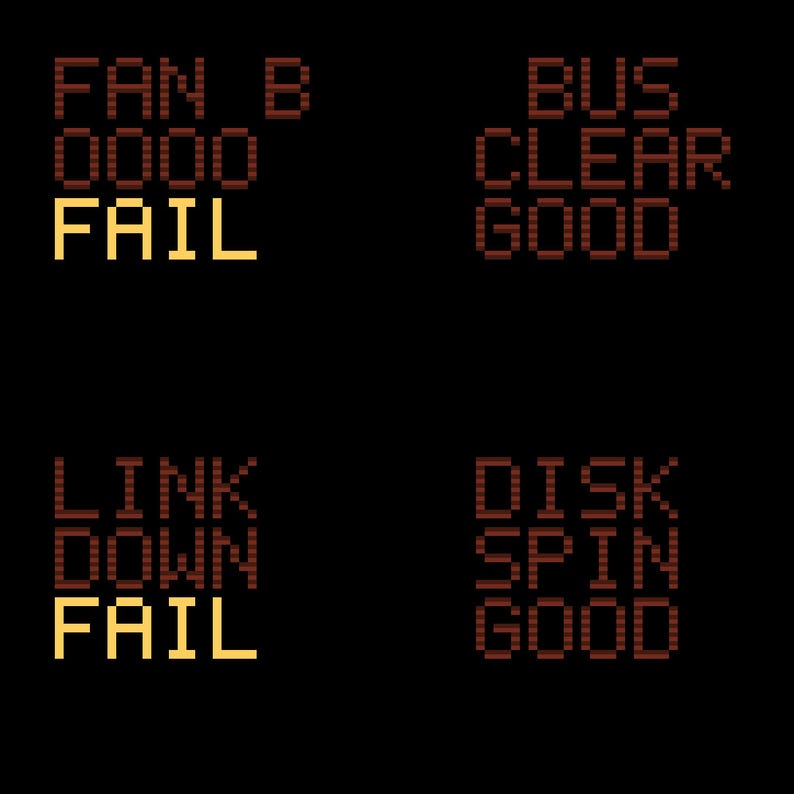 May include: A digital display with four status blocks on a black background. The top left shows FAN B 0000 FAIL in yellow. The top right shows BUS CLEAR GOOD in dark red. The bottom left shows LINK DOWN FAIL in yellow. The bottom right shows DISK SPIN GOOD in dark red.