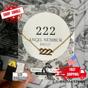 May include: Gold 222 Angel Number bracelet on a white background with the words "Angel Number Bracelet" and "222" in black text. The bracelet is displayed on a white card with a gold chain.