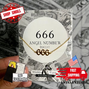May include: Gold 666 Angel Number bracelet on a white card with the text "666 Angel Number Bracelet". The bracelet is made of a gold chain with a gold pendant that says "666".