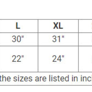 May include: A size chart for clothing, with measurements in inches. The chart includes sizes S through 5XL, detailing body length and chest width (laid flat) for each size. The text "All the sizes are listed in inches" is at the bottom.