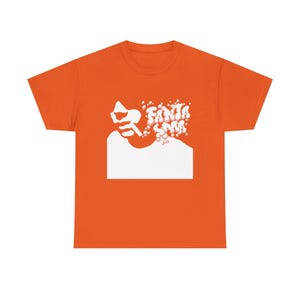 May include: Orange t-shirt with a white graphic. The graphic features a stylized silhouette of a person smoking, with the word "FANTASMS" in a bubble-like font. The shirt is a solid orange color.