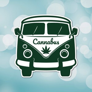 May include: A dark green sticker of a vintage van with the word "Cannabus" above a cannabis leaf. The van has a white outline and is set against a light blue background with white bokeh.