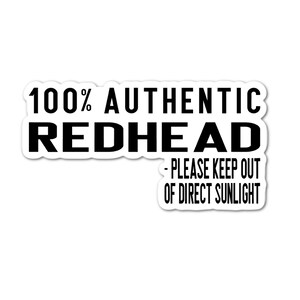May include: White sticker with black text that reads "100% Authentic Redhead - Please keep out of direct sunlight."