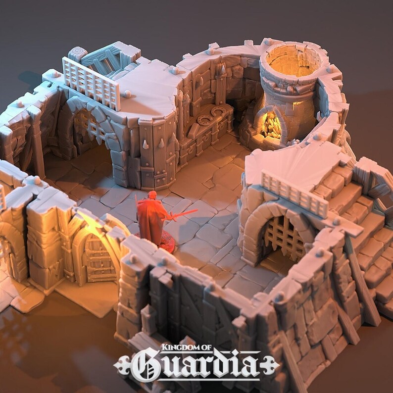 A gray 3D-printed miniature of the second floor of a blacksmith's lodge, with the roof and ground floor removed, showing an open interior with a red-robed figure.